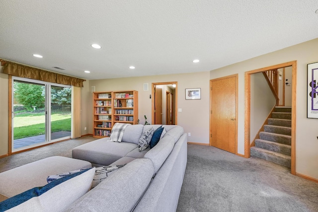 7111 Trenton Ln N, Maple Grove, MN 55369 - living area featuring carpet flooring, recessed lighting, a textured ceiling, and stairs