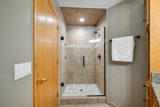 7111 Trenton Ln N, Maple Grove, MN 55369 - full bath with a stall shower, a textured ceiling, and vanity
