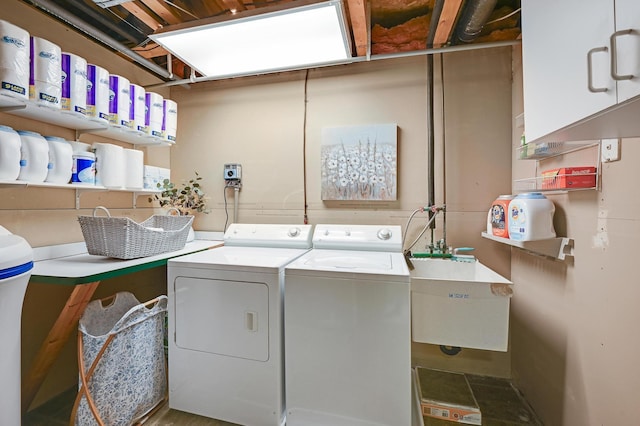 7111 Trenton Ln N, Maple Grove, MN 55369 - laundry room featuring separate washer and dryer and cabinet space