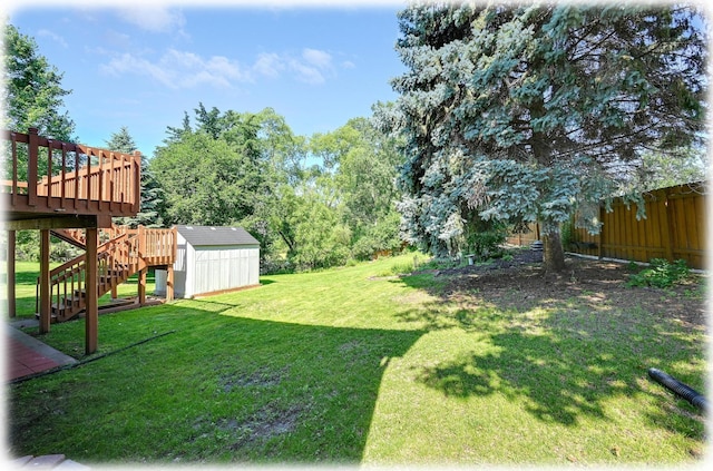 7111 Trenton Ln N, Maple Grove, MN 55369 - view of green lawn featuring a storage unit, stairs, and a wooden deck