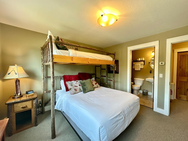 6940 Beach View Ln NW Unit 220-1, Walker, MN 56484 - bedroom with carpet flooring and ensuite bath