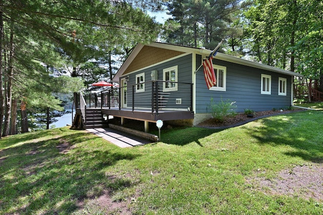N2590 Warren Rd, Madge Twp, WI 54870 - view of home's exterior with a wooden deck and a yard