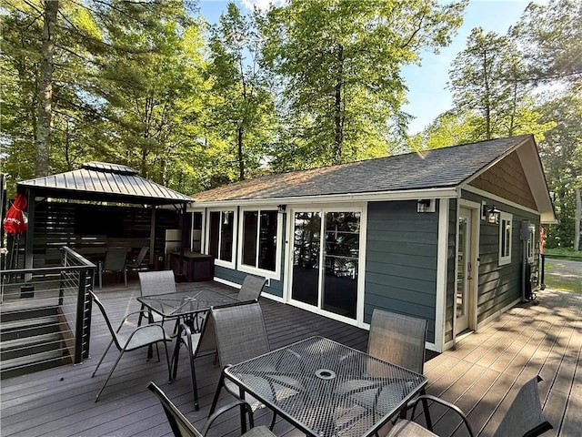 N2590 Warren Rd, Madge Twp, WI 54870 - wooden terrace with outdoor dining space and a gazebo