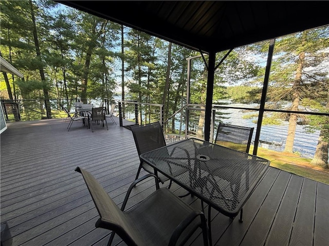 N2590 Warren Rd, Madge Twp, WI 54870 - sunroom / solarium with outdoor dining space and view of scattered trees