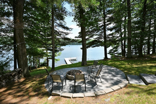 N2590 Warren Rd, Madge Twp, WI 54870 - view of patio / terrace featuring a water view and a fire pit