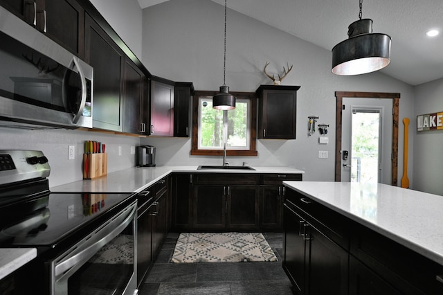 N2590 Warren Rd, Madge Twp, WI 54870 - kitchen featuring appliances with stainless steel finishes, lofted ceiling, plenty of natural light, dark cabinetry, and recessed lighting