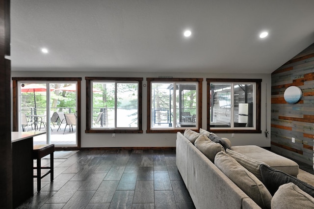N2590 Warren Rd, Madge Twp, WI 54870 - living room with wood walls, recessed lighting, and lofted ceiling