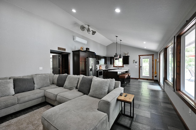 N2590 Warren Rd, Madge Twp, WI 54870 - living area featuring a wall unit AC, vaulted ceiling, plenty of natural light, and recessed lighting