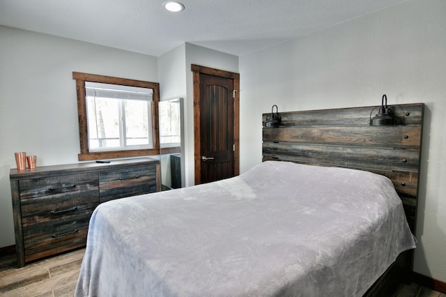 N2590 Warren Rd, Madge Twp, WI 54870 - bedroom with light wood finished floors and recessed lighting