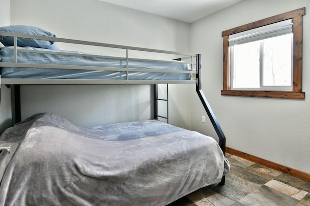 N2590 Warren Rd, Madge Twp, WI 54870 - bedroom with baseboards