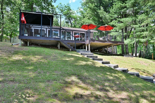 N2590 Warren Rd, Madge Twp, WI 54870 - rear view of house featuring stairway, a wooden deck, and a yard