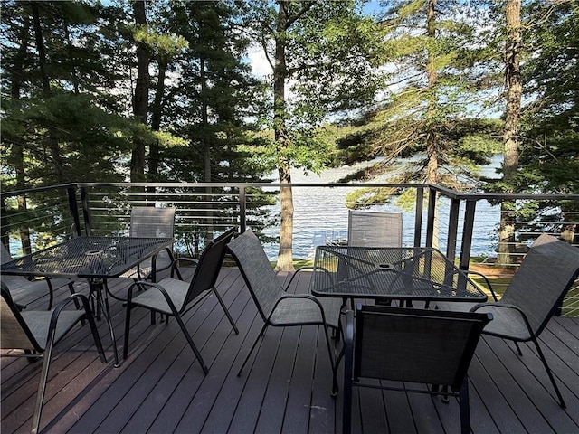 N2590 Warren Rd, Madge Twp, WI 54870 - deck featuring outdoor dining space and a water view