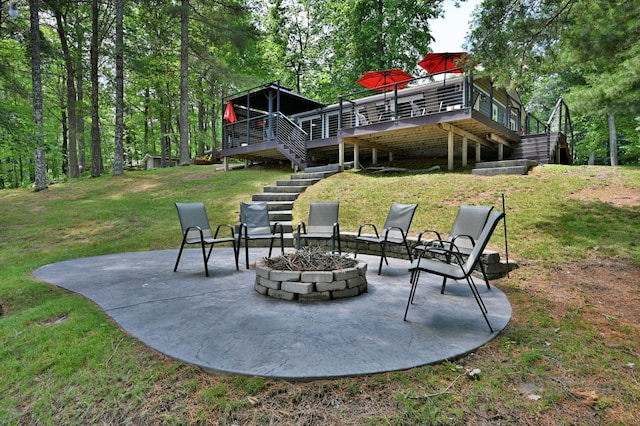 N2590 Warren Rd, Madge Twp, WI 54870 - view of grassy yard with stairs, a patio area, an outdoor fire pit, and a deck