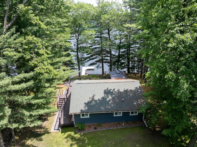 N2590 Warren Rd, Madge Twp, WI 54870 - view of side of property featuring stairway, a yard, and a shingled roof