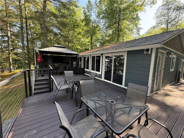 N2590 Warren Rd, Madge Twp, WI 54870 - deck featuring outdoor dining area and a gazebo
