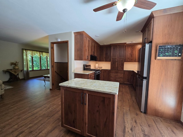 21200 5th St NW, Colfax Twp, MN 56273 - kitchen featuring stainless steel appliances, dark wood-style floors, light stone counters, and a ceiling fan