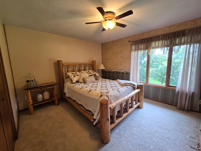 21200 5th St NW, Colfax Twp, MN 56273 - bedroom featuring a textured ceiling, carpet floors, and ceiling fan