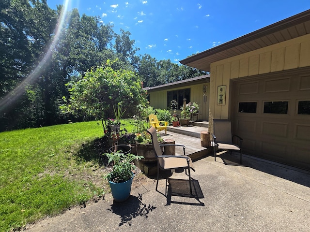 21200 5th St NW, Colfax Twp, MN 56273 - view of patio / terrace with an attached garage