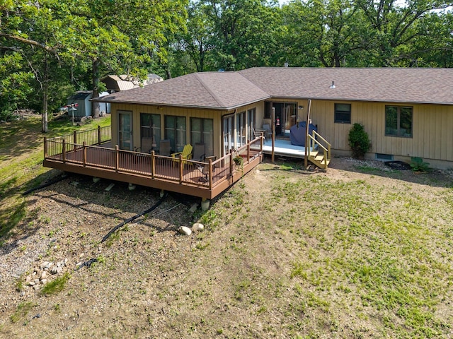 21200 5th St NW, Colfax Twp, MN 56273 - rear view of property with a wooden deck, a shingled roof, and a lawn