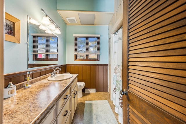 13235 80th St NW, Annandale, MN 55302 - full bathroom with wainscoting, vanity, and curtained shower