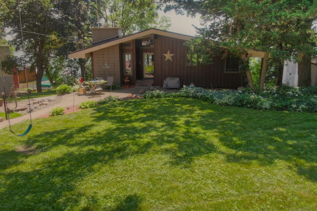 13235 80th St NW, Annandale, MN 55302 - mid-century home featuring a patio area and a front lawn