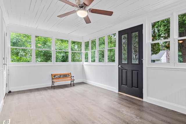 2168 Centerview Ln, Mound, MN 55364 - unfurnished sunroom with baseboards and wood finished floors