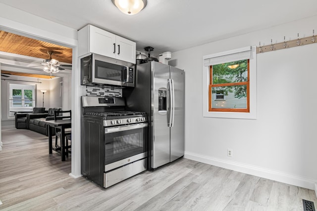 2168 Centerview Ln, Mound, MN 55364 - kitchen with stainless steel appliances, light wood-type flooring, white cabinetry, and a ceiling fan