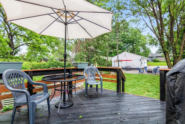 2168 Centerview Ln, Mound, MN 55364 - wooden deck featuring a yard, an outbuilding, and outdoor dining area