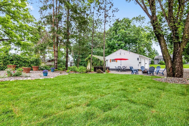 2168 Centerview Ln, Mound, MN 55364 - view of green lawn featuring a fire pit and a patio