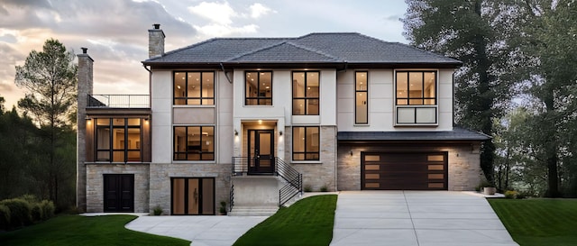 1545 Minnie Ave, Orono, MN 55364 - contemporary house with stone siding, a balcony, driveway, and a chimney