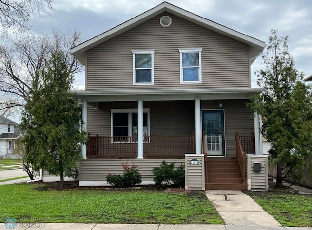 802 11th Ave N, Fargo, ND 58102 - traditional style home with a porch and a front yard