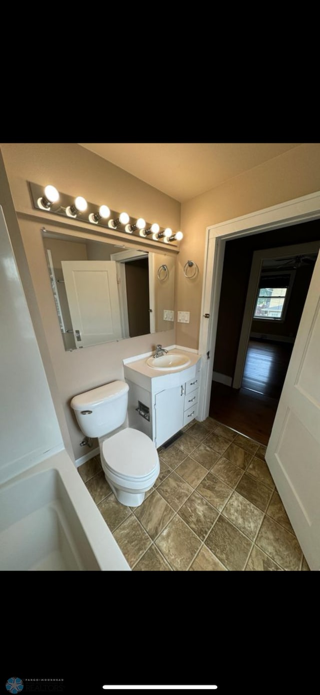 802 11th Ave N, Fargo, ND 58102 - bathroom featuring toilet and vanity