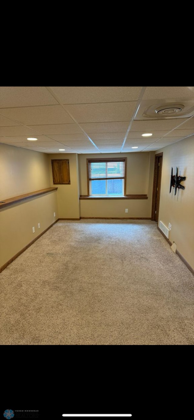 802 11th Ave N, Fargo, ND 58102 - basement featuring carpet and a paneled ceiling