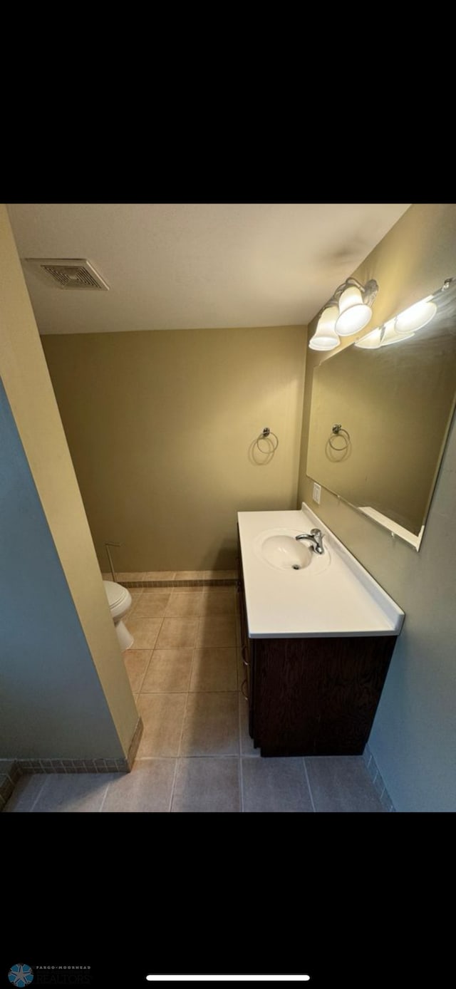 802 11th Ave N, Fargo, ND 58102 - bathroom with vanity and tile patterned floors