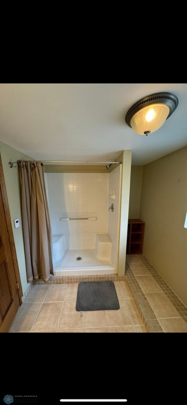 802 11th Ave N, Fargo, ND 58102 - full bathroom with a shower with shower curtain