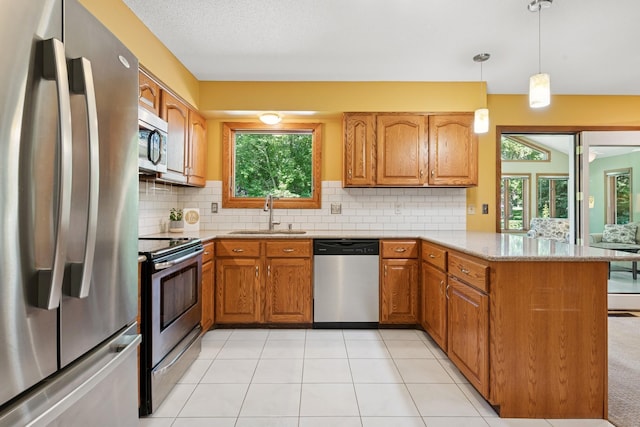 10316 Zinran Ave S, Bloomington, MN 55438 - kitchen with stainless steel appliances, a peninsula, brown cabinetry, decorative backsplash, and pendant lighting