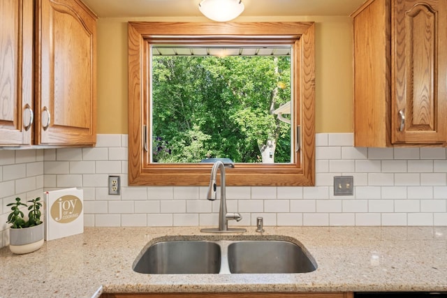 10316 Zinran Ave S, Bloomington, MN 55438 - kitchen with plenty of natural light, backsplash, and light stone countertops