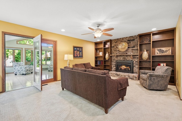 10316 Zinran Ave S, Bloomington, MN 55438 - living room with light carpet, a ceiling fan, a brick fireplace, recessed lighting, and built in shelves