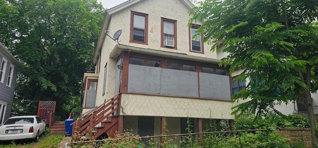 713 Preble St, Saint Paul, MN 55130 - view of home's exterior with stucco siding
