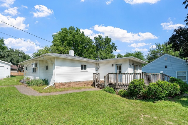 905 Bellows St, West Saint Paul, MN 55118 - rear view of house featuring a yard, a wooden deck, and a chimney