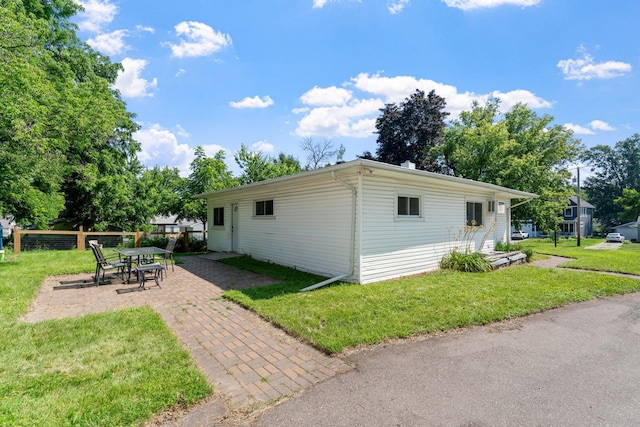 905 Bellows St, West Saint Paul, MN 55118 - view of side of home featuring a patio area