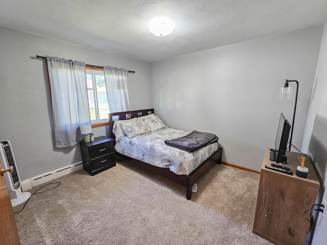460 3rd St, Bird Island, MN 55310 - carpeted bedroom with a baseboard radiator and baseboards