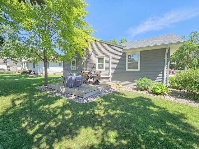 460 3rd St, Bird Island, MN 55310 - back of property with a lawn and a deck