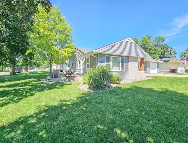 460 3rd St, Bird Island, MN 55310 - rear view of house featuring a yard, concrete driveway, and brick siding