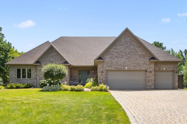 13703 47th St NE, Saint Michael, MN 55376 - view of front of property with brick siding, a garage, a front lawn, driveway, and roof with shingles