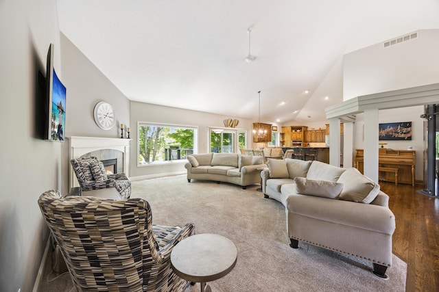 13703 47th St NE, Saint Michael, MN 55376 - living room featuring a tiled fireplace, lofted ceiling, recessed lighting, and dark wood-style floors