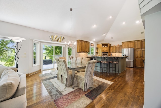 13703 47th St NE, Saint Michael, MN 55376 - dining area with a chandelier, dark wood finished floors, healthy amount of natural light, lofted ceiling, and recessed lighting