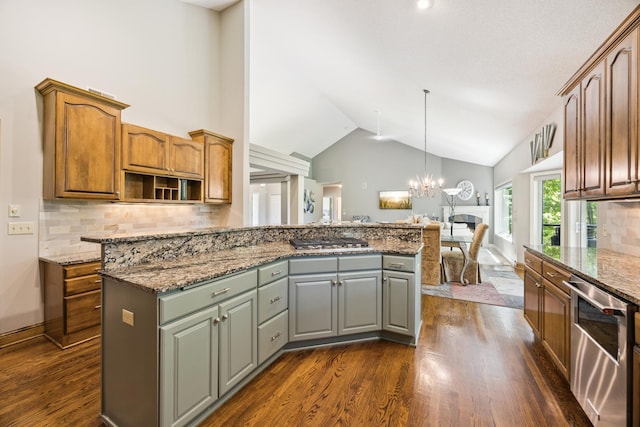 13703 47th St NE, Saint Michael, MN 55376 - kitchen with appliances with stainless steel finishes, dark wood-type flooring, open floor plan, decorative backsplash, and lofted ceiling