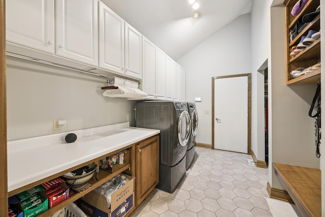 13703 47th St NE, Saint Michael, MN 55376 - laundry area featuring washing machine and dryer, cabinet space, and light tile patterned flooring