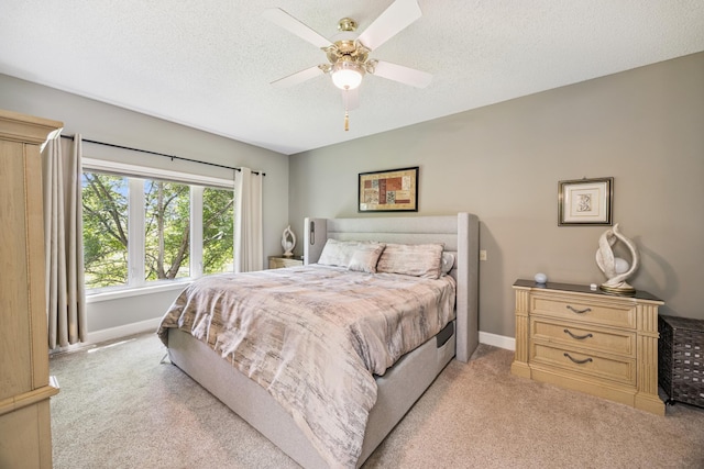 13703 47th St NE, Saint Michael, MN 55376 - bedroom featuring light carpet, a textured ceiling, and ceiling fan